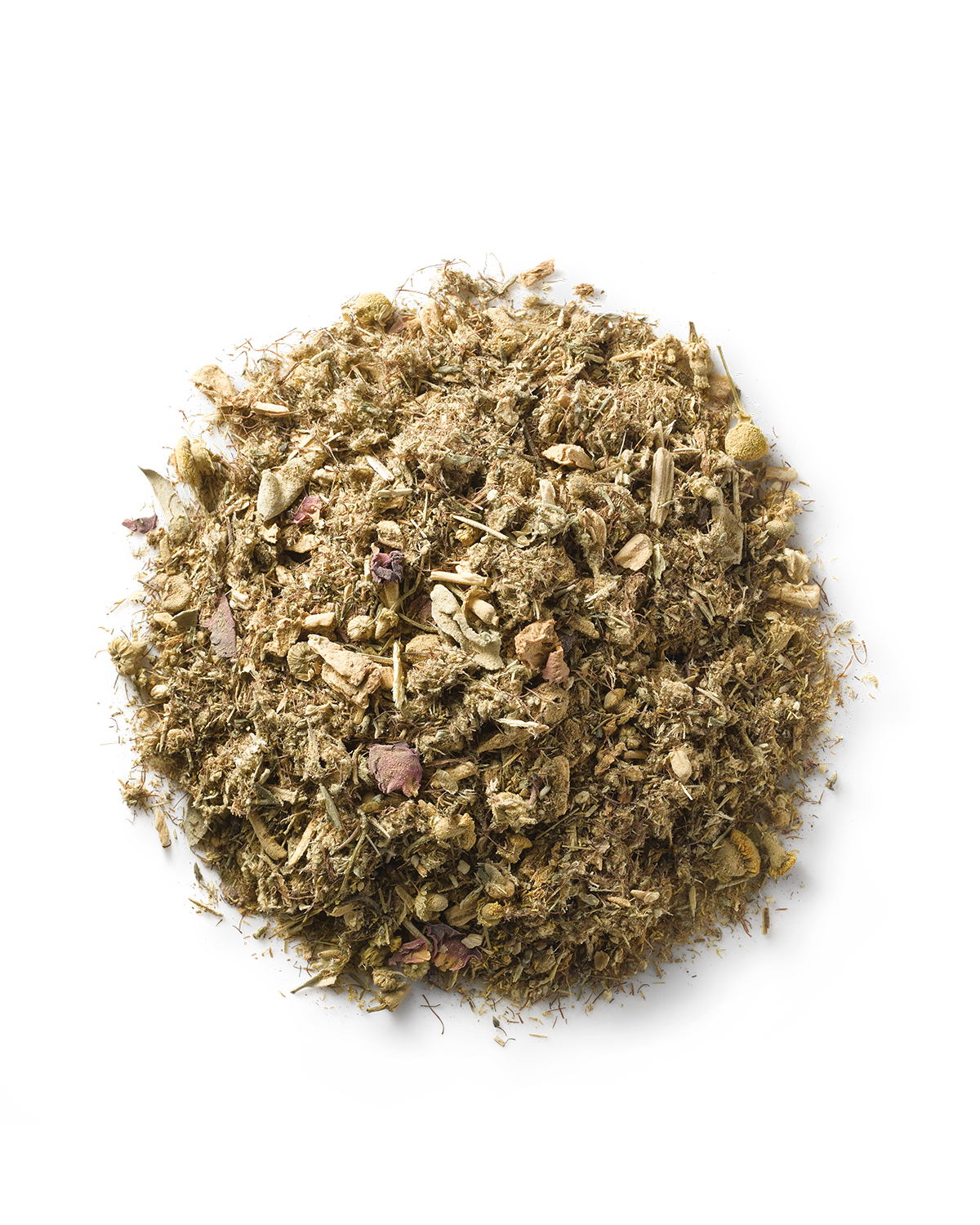 A pile of Ayurvedic herbs on a white background. The finely ground mixture, with small pieces of varied textures and brownish hues, is ideal for enhancing reproductive health through Yoni steam practices using Surya's (y)oni Reset Steam.