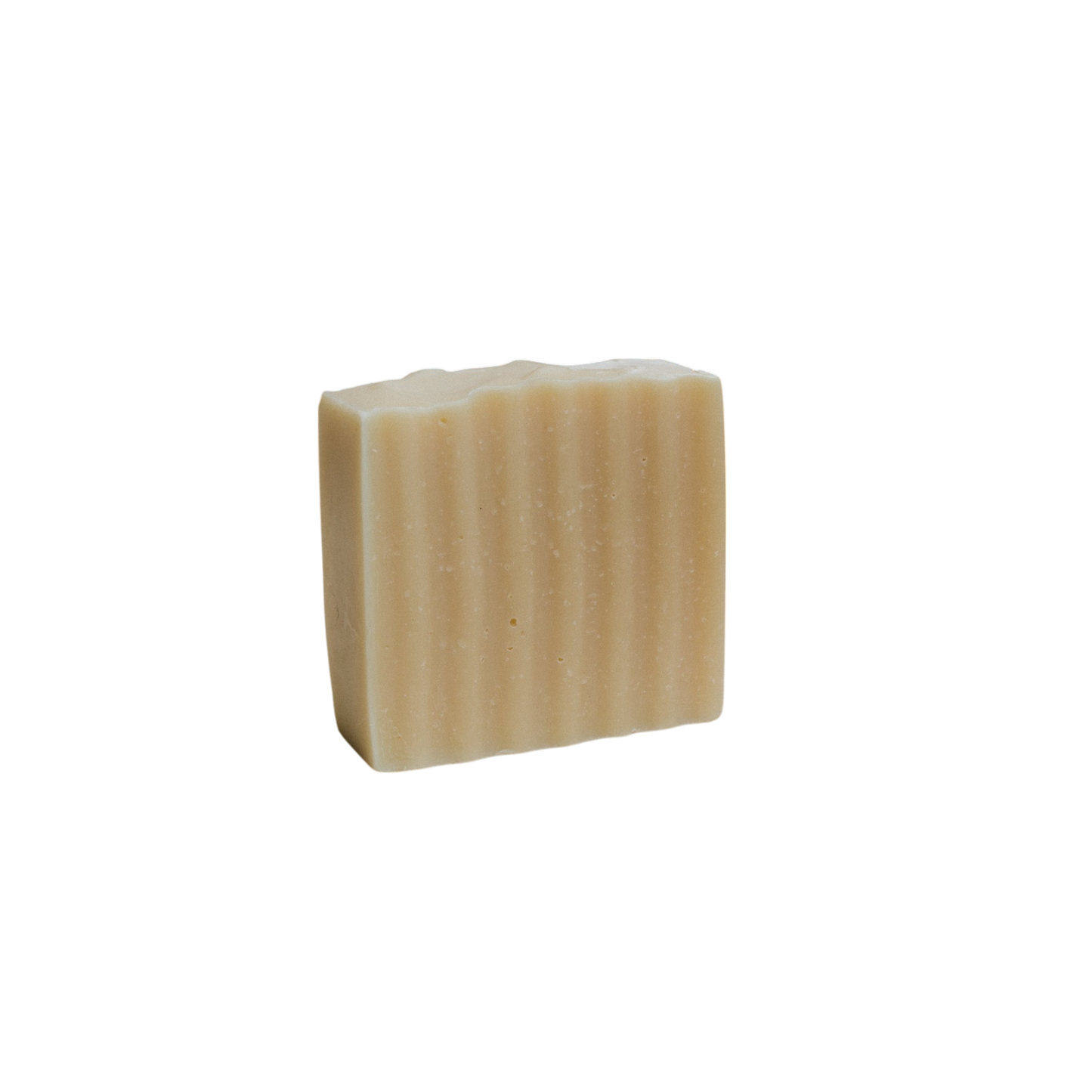 The Honeybee Hippie honeybee tallow soap bar, with its rectangular shape and light beige tone, features a wavy, ribbed texture. It stands upright against a white background and is infused with the soothing essence of organic herbs.