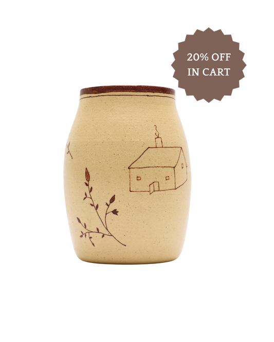 The Baile Homestead Vase by Baile is a handmade beige ceramic vase with a brown house and branch design plus a brown rim—perfect for natural decor. Save 20% in cart.