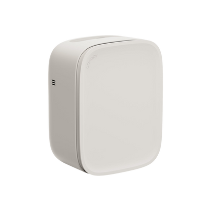 The Canopy Bedside Air Purifier is a sleek, modern white unit with rounded edges and a minimalist design. It features a small side vent and operates ultra-quietly, making it perfect for bedrooms.