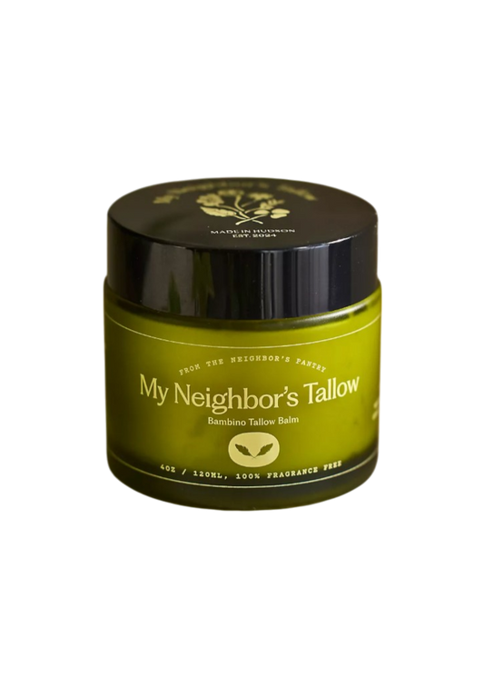 A green jar of "Bambino Balm - Fragrance Free Tallow" by My Neighbor’s Tallow, made with grass-fed tallow (4oz/120mL), features a black lid, minimalist design, and is 100% fragrance free—perfect for sensitive skin.