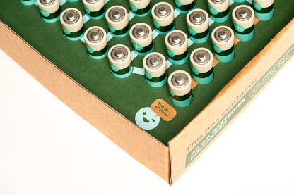 A cardboard box labeled "AA 40 Pack" from Better Battery Co., containing multiple rows of AA alkaline batteries, each featuring a silver cap. The corner of the recyclable packaging displays a sticker with a smiley face and the message "100% checked for quality.