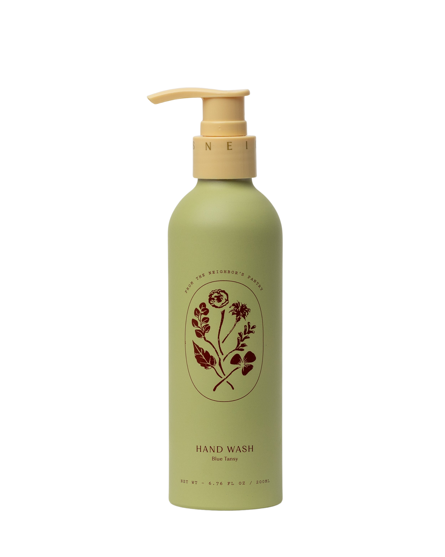 A green bottle of Blue Tansy Hand Wash by My Neighbor’s Tallow, featuring a beige pump dispenser, floral illustration, and the product name on the front.