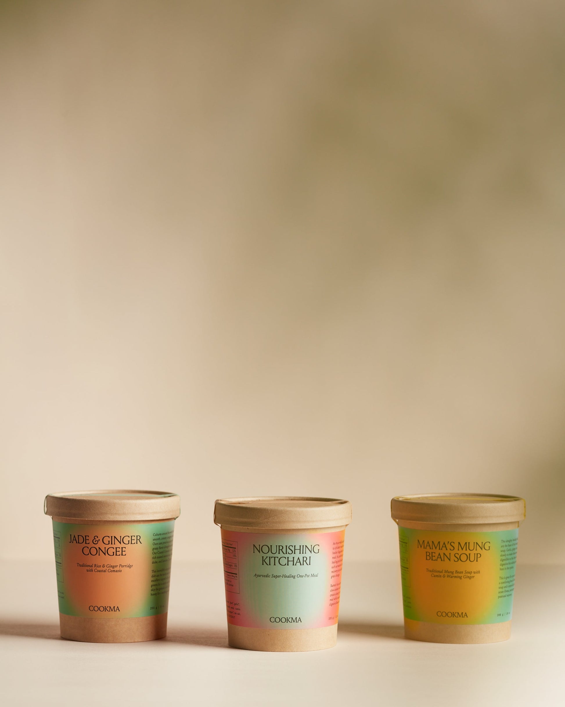 The Cookma Healing Bundle—featuring three tubs of nourishing foods—is displayed side by side against a softly lit, neutral background, ideal for immune support or surgery recovery.