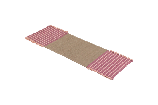 Product: Dark Harda and Sappan Wood Ayurvedic Yoga Mat by Bennd Yoga  
Description: A woven yoga mat crafted from organic materials showcases a beige center with pink striped fringed edges, presented on a plain background.