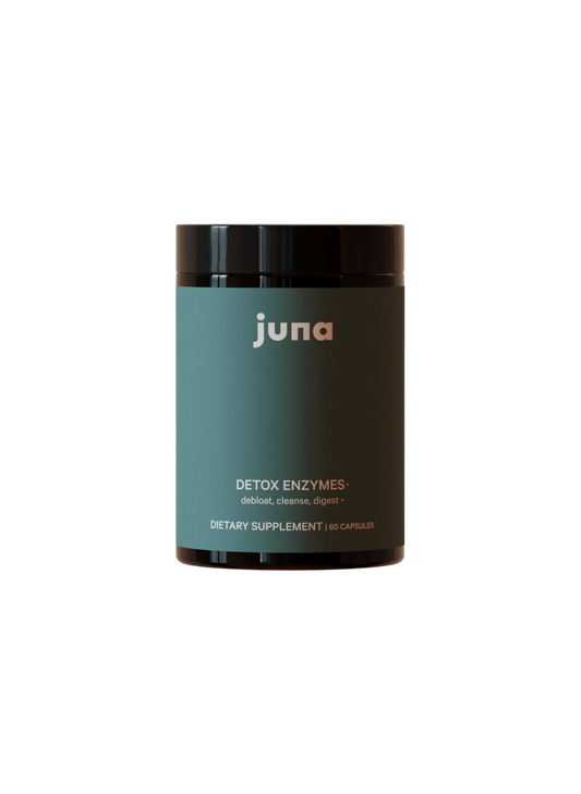 A dark green Juna bottle labeled "Detox Digestive Enzymes" with "de-bloat, cleanse, digest," and "60 capsules" on the front. Contains digestive enzymes to support gut health. The background is plain black.