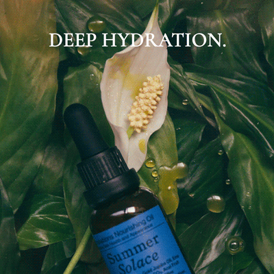 A brown dropper bottle labeled "Summer Solace Tallow" rests on green leaves. White text above says "DEEP HYDRATION." Replenish skin and hair with Emanations Profound Face Oil – Deeply Nourishing | Champa, Tuberose & White Ginger Lily.