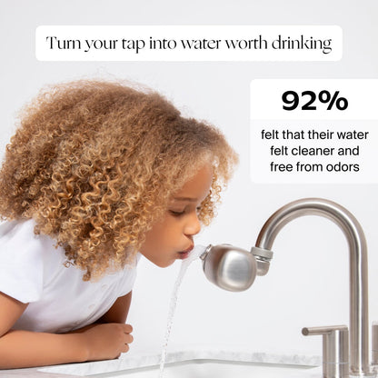 A young child with curly hair drinks water from a kitchen faucet fitted with the Canopy Faucet Filter, alongside text: "Turn your tap into water worth drinking" and "92% felt their water was cleaner and free from odors." Fulfilled by Canopy.