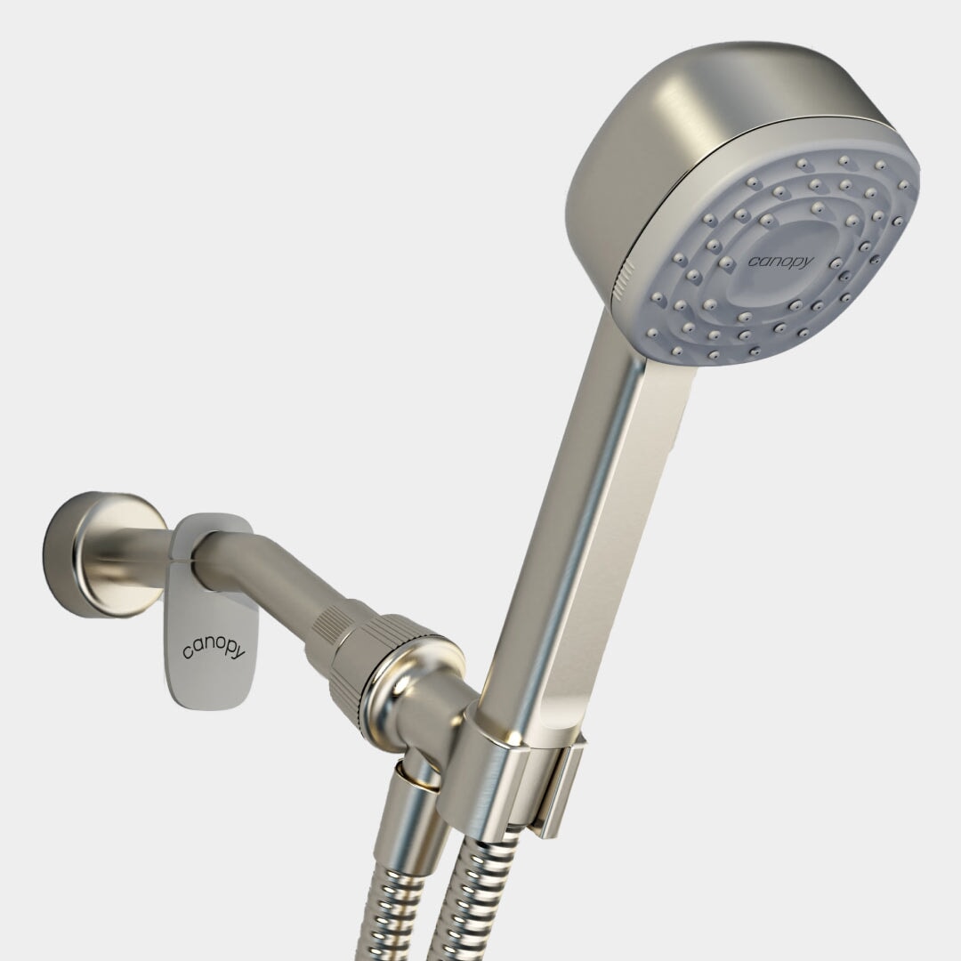 The Canopy Handheld Filtered Showerhead features a modern metallic design, flexible hose, multiple water nozzles, and wall bracket for a refreshing and customizable shower experience.