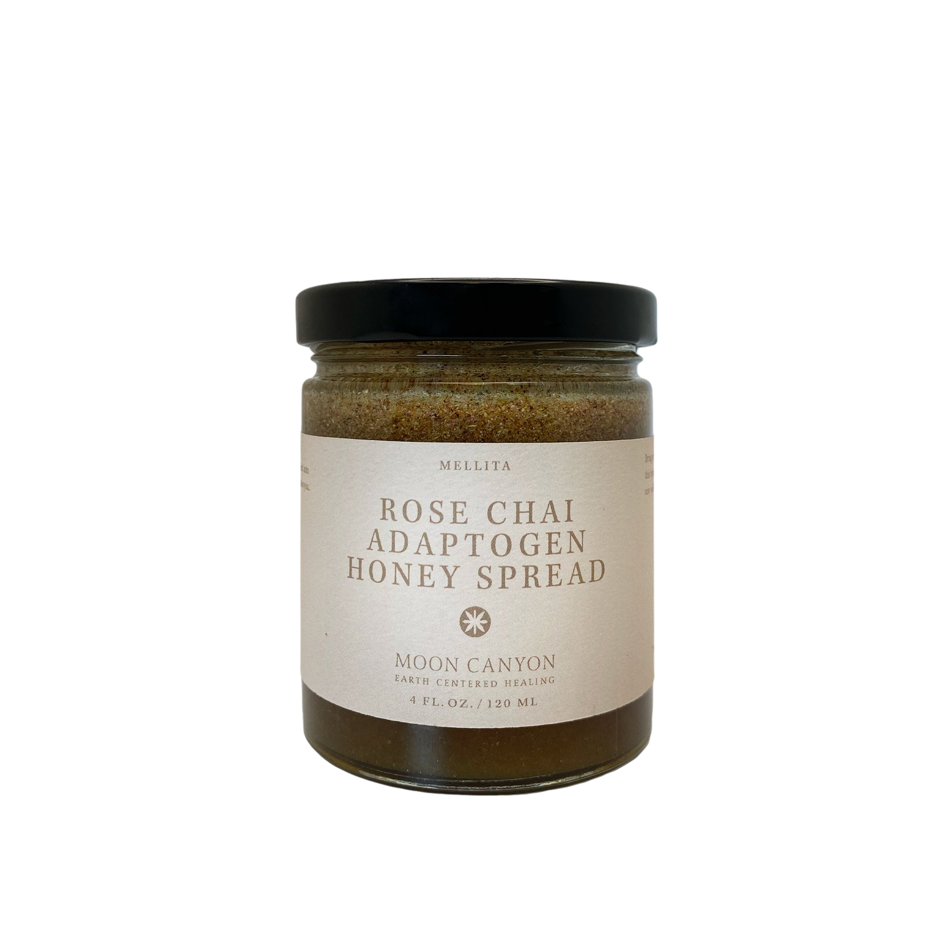 A glass jar with a black lid is labeled "Rose Chai Adaptogen Honey" by Moon Canyon Healing. The label also includes "Moon Canyon" and describes it as "Earth Certified Healing." Blended with chai spices for healthy circulation, the jar contains 4 fl. oz. (120 mL) of the product against a plain black background.