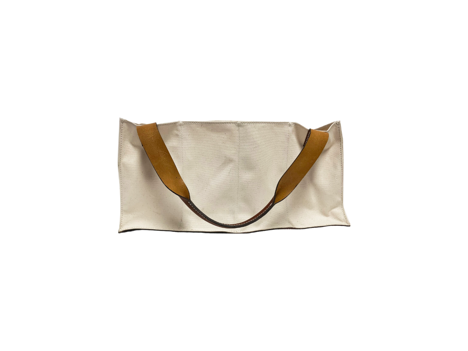 An Agnes Baddoo Market Sac with beige canvas and brown leather handles is pictured against a white background. 