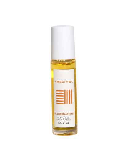 A 0.34 fl oz glass bottle of & Tread Well's Natural Fragrance – Illumination, with a white cap and orange design, offers portable aromatherapy for stress relief.