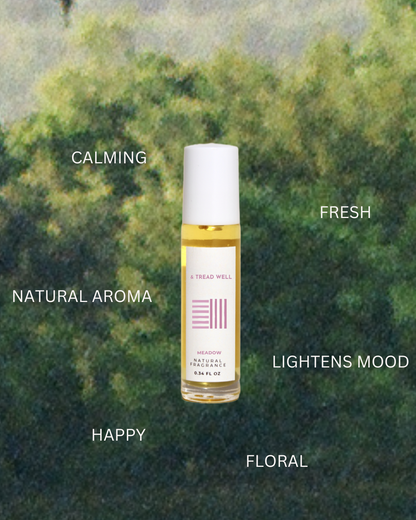 A bottle of & Tread Well Natural Fragrance – Meadow sits against a blurred green backdrop, offering a calming, fresh floral aroma that brightens the mood with its happy natural meadow scent.