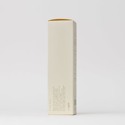 A tall, rectangular cream-colored box of My Neighbor’s Tallow Blue Tansy Hand Wash stands upright against a plain white background, featuring minimal design and small printed text near the bottom left corner.