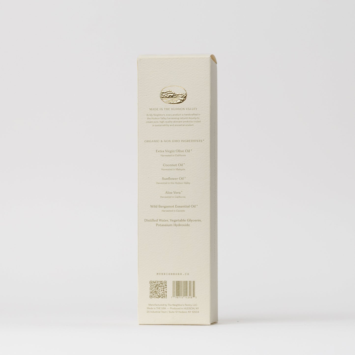 The back of My Neighbor’s Tallow Blue Tansy Hand Wash box features a gold logo, ingredients, company info, and QR codes in elegant fine print on a white background.