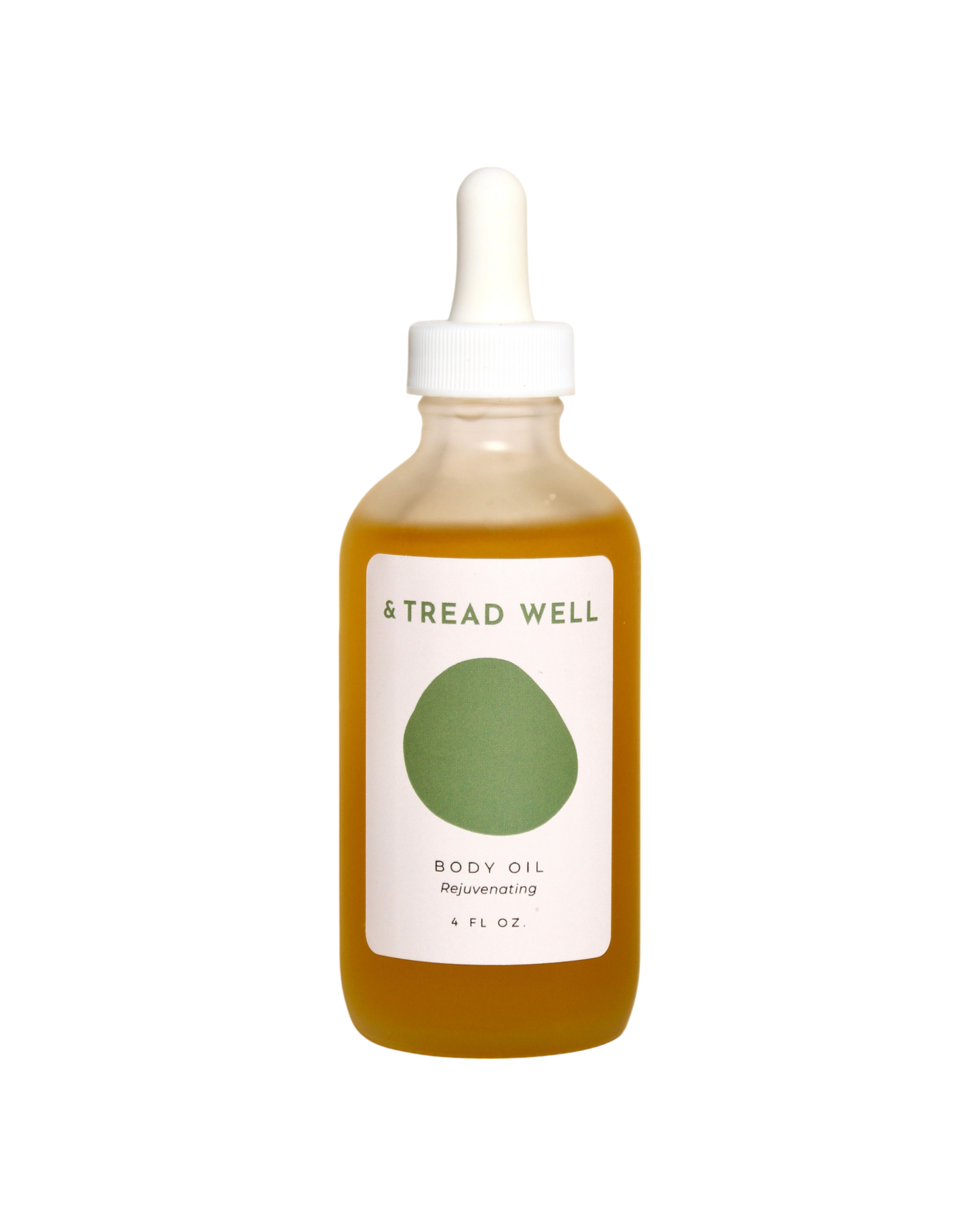 A clear glass dropper bottle of & Tread Well Body Oil, filled with golden oil and featuring a white and green label, designed to nourish skin, is shown against a black background.