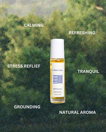A small bottle of "& Tread Well Natural Fragrance - Nostalgia" sits centered against a blurred green nature background, surrounded by words: calming, refreshing, stress relief, tranquil, grounding, pure essential oils.