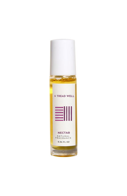 A 0.35 fl oz & Tread Well Natural Fragrance - Nectar non-toxic perfume with a white cap and yellow liquid, made with pure essential oils, is shown against a plain black background.
