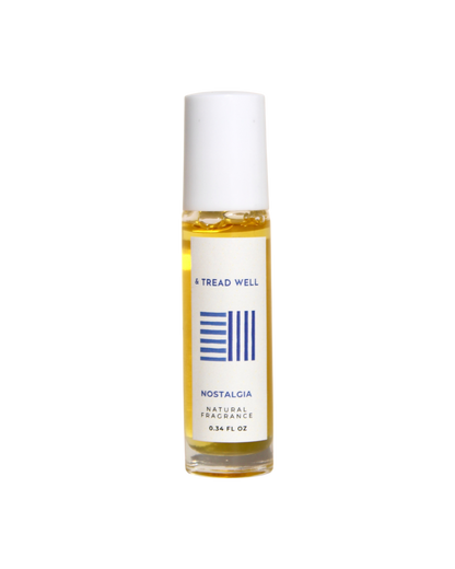 A 0.34 fl oz glass bottle of & Tread Well Natural Fragrance - Nostalgia, with a white cap and minimalist white label featuring blue text and lines.