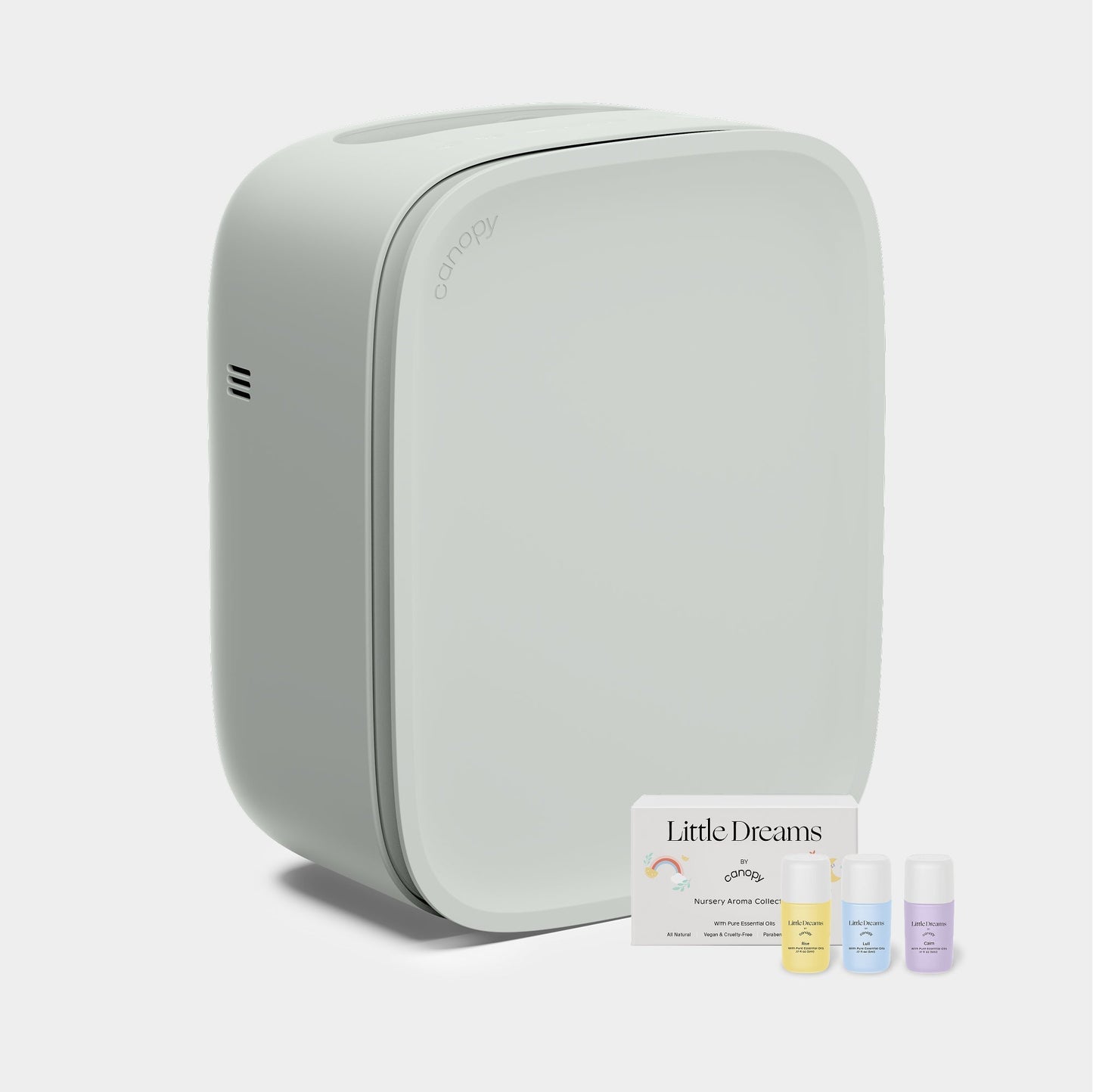 Jade The Canopy Nursery Air Purifier features a sleek, modern design with rounded edges and comes with three essential oil bottles and a "Little Dreams Nursery Aroma Kit" card. Fulfilled by Canopy for peace of mind.