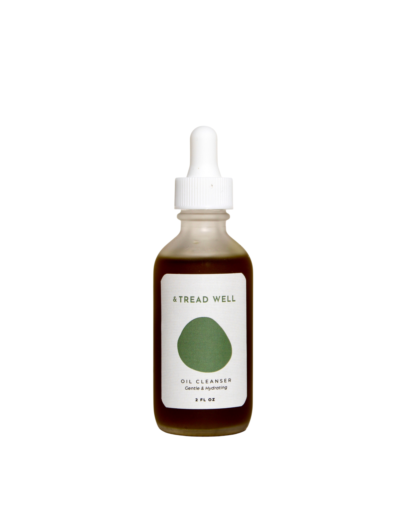 A brown glass dropper bottle labeled "& Tread Well Oil Cleanser" with a white cap and green design sits against a black background—this organic cleanser from & Tread Well helps fade dark spots.