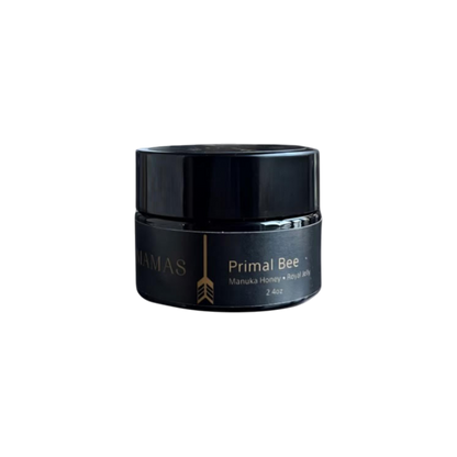 A small black jar labeled "Wildly Nourishing Bison Tallow Balm - Primal Bee (Manuka & Royal Jelly)" by Wild Mamas, 2.4 oz, sits against a plain light gray background—perfect as a nourishing balm for tallow skincare routines.