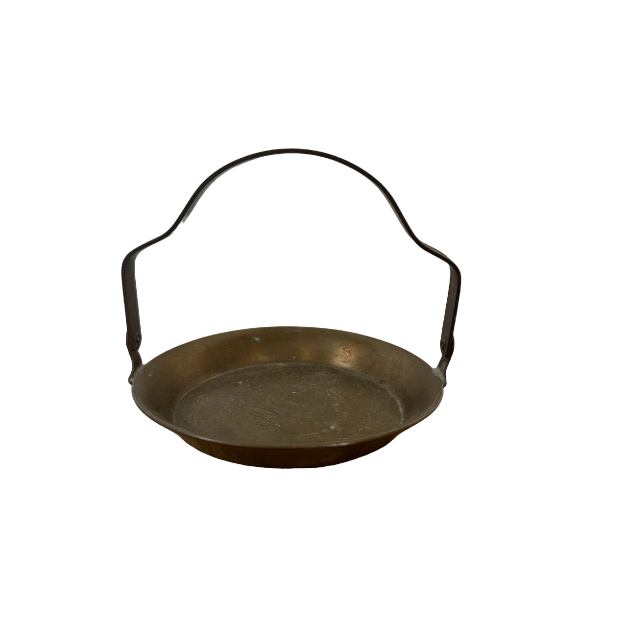 Introducing the Mini Brass Tray by Shoppe Maison: A round, bronze-colored metal tray with a flat bottom and slightly raised sides. This vintage-inspired piece features a curved metal handle on opposite sides, ideal for carrying or hanging. Set against a black background, it stands out prominently and doubles as an elegant piece of home decor.
