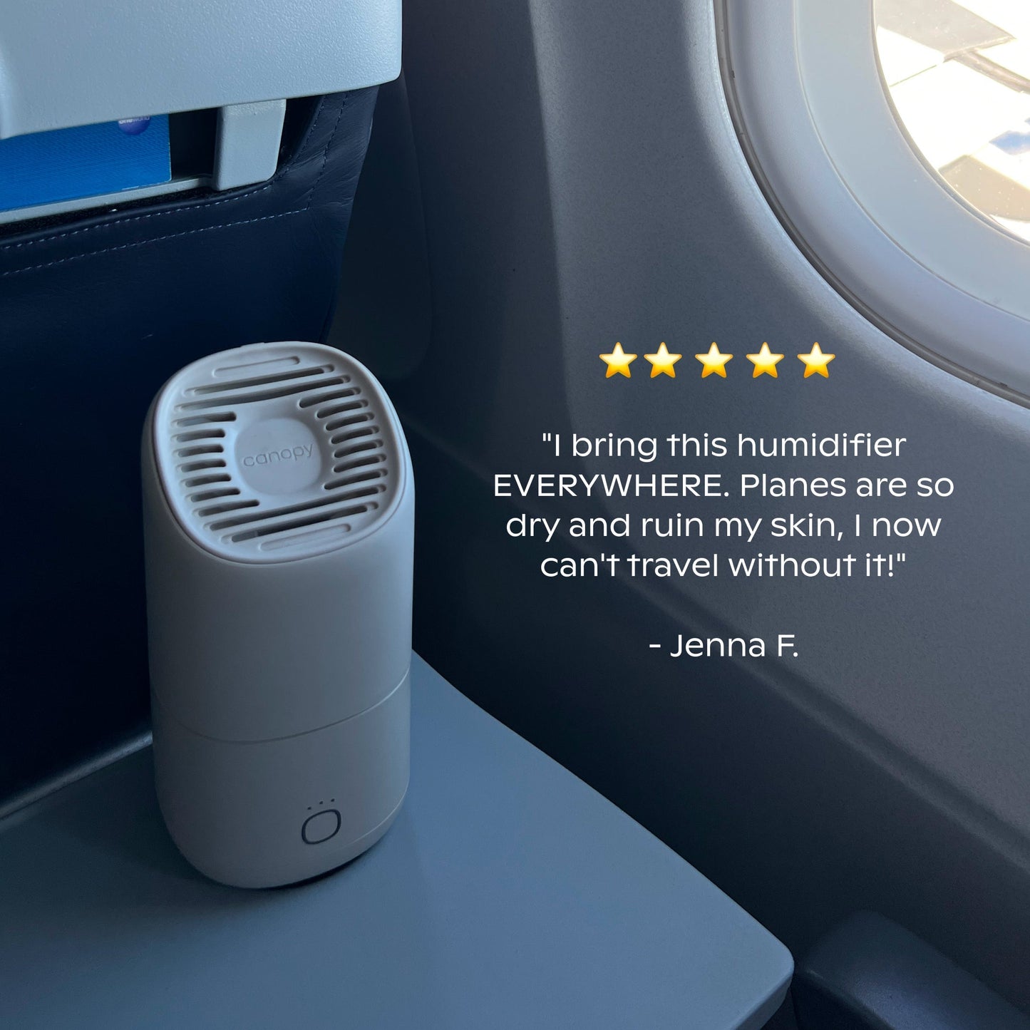 The Canopy Portable Humidifier sits on an airplane tray table by a window, displaying a five-star review and a testimonial praising its usefulness for travel.