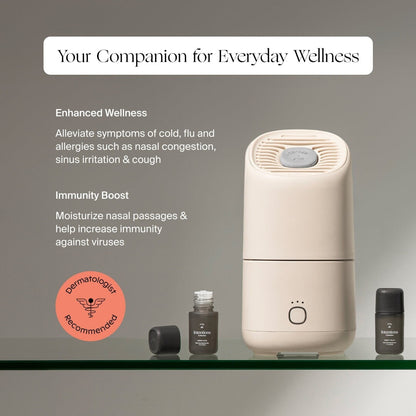 A beige Canopy Portable Humidifier rests on a glass shelf beside two small essential oil bottles. Text highlights boosted wellness, improved immunity, and dermatological recommendation. Now fulfilled by Canopy.
