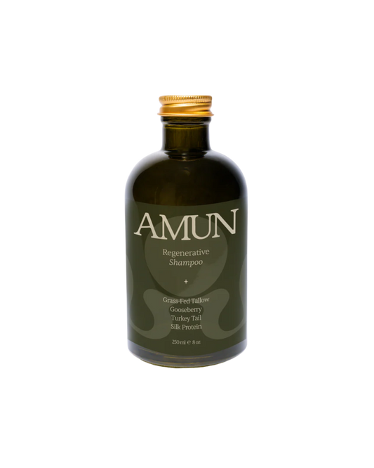 A dark green 250 ml (8 oz) bottle of Amun Organics REGENERATIVE SHAMPOO with a gold cap, infused with grass-fed tallow, gooseberry, turkey tail, and silk protein for scalp rejuvenation.
