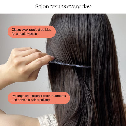 A person combs their long, straight brown hair. Text bubbles say: "Filtered Showerhead by Canopy clears away product buildup for a healthy scalp" and "Prolongs professional color treatments and prevents breakage." Fulfilled by Canopy.