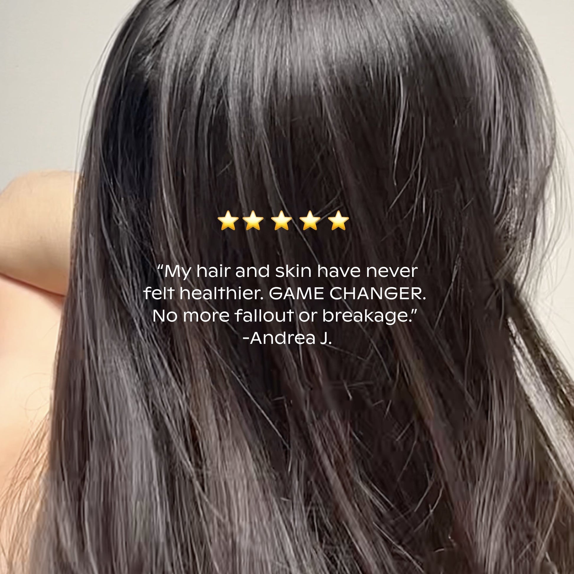 A woman with long, shiny, healthy dark hair (back view) appears with overlay text: “★★★★★ My hair is healthier, with less fallout and no breakage!”—Canopy Filtered Showerhead testimonial from Andrea J.