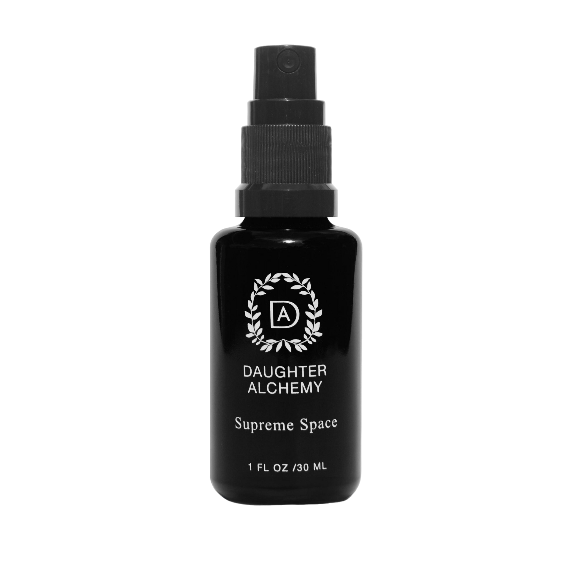 A black spray bottle labeled "Daughter Alchemy" with the text "Supreme Space® Botanical Protective Spray" and "1 FL OZ / 30 ML" near the bottom. The label, adorned with a stylized logo encircled by a wreath design, indicates the inclusion of organic white sage. The bottle has a black cap and a spray nozzle.