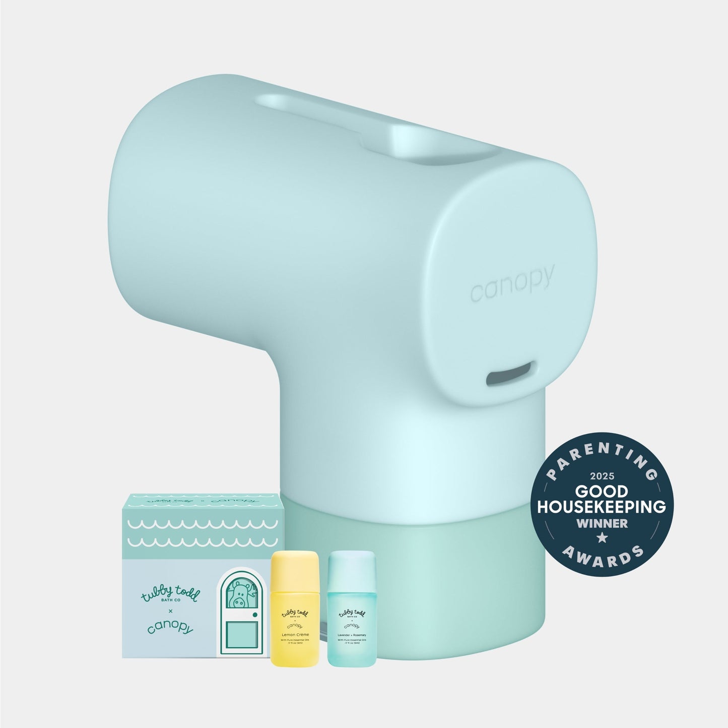 Seafoam A Canopy Baby Bath Tub Filter in light blue is shown with three small bottles and a box on a plain light gray background. A circular badge reads "2025 Good Housekeeping Winner Parenting Awards." Fulfilled by Canopy.