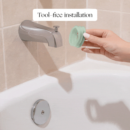 White Lavender Jade Butter Seafoam Oat
A hand installs a green Canopy Baby Bath Tub Filter onto a bathtub spout, demonstrating tool-free installation. The image features the caption "Tool-free installation" above the spout.