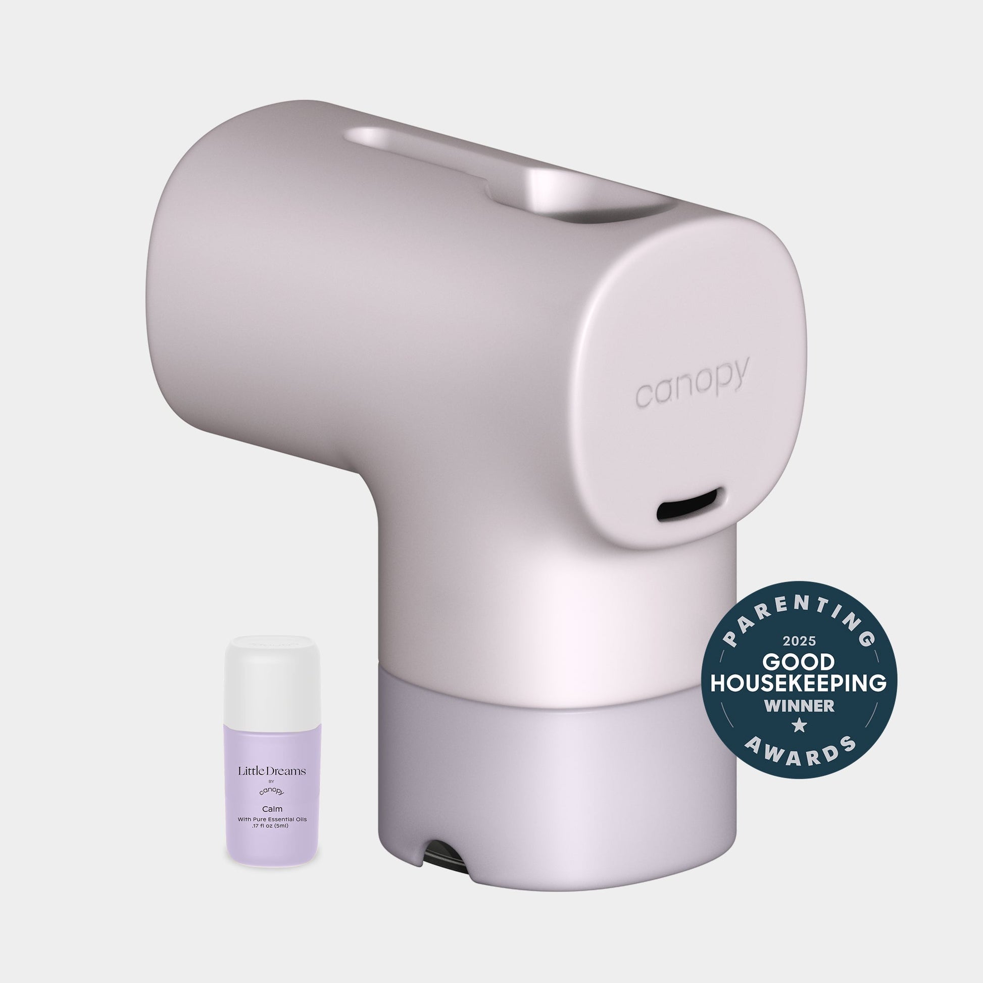 A modern Canopy Baby Bath Tub Filter with a small lavender scent bottle beside it and a blue badge indicating it won the 2025 Good Housekeeping Parenting Awards. Fulfilled by Canopy.