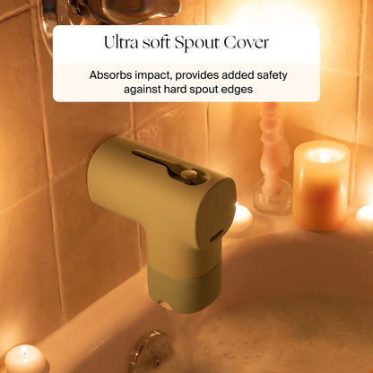 A Canopy Bath Tub Filter is attached to a faucet, surrounded by candles on the tub edge. Text above highlights that the Canopy Bath Tub Filter absorbs impact for added safety against hard surfaces with its ultra soft material.