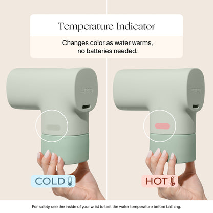 A hand holds the Canopy Bath Tub Filter, which changes color—greenish for cold (left), pale white for hot (right)—to indicate water temperature. This accessory needs no batteries.