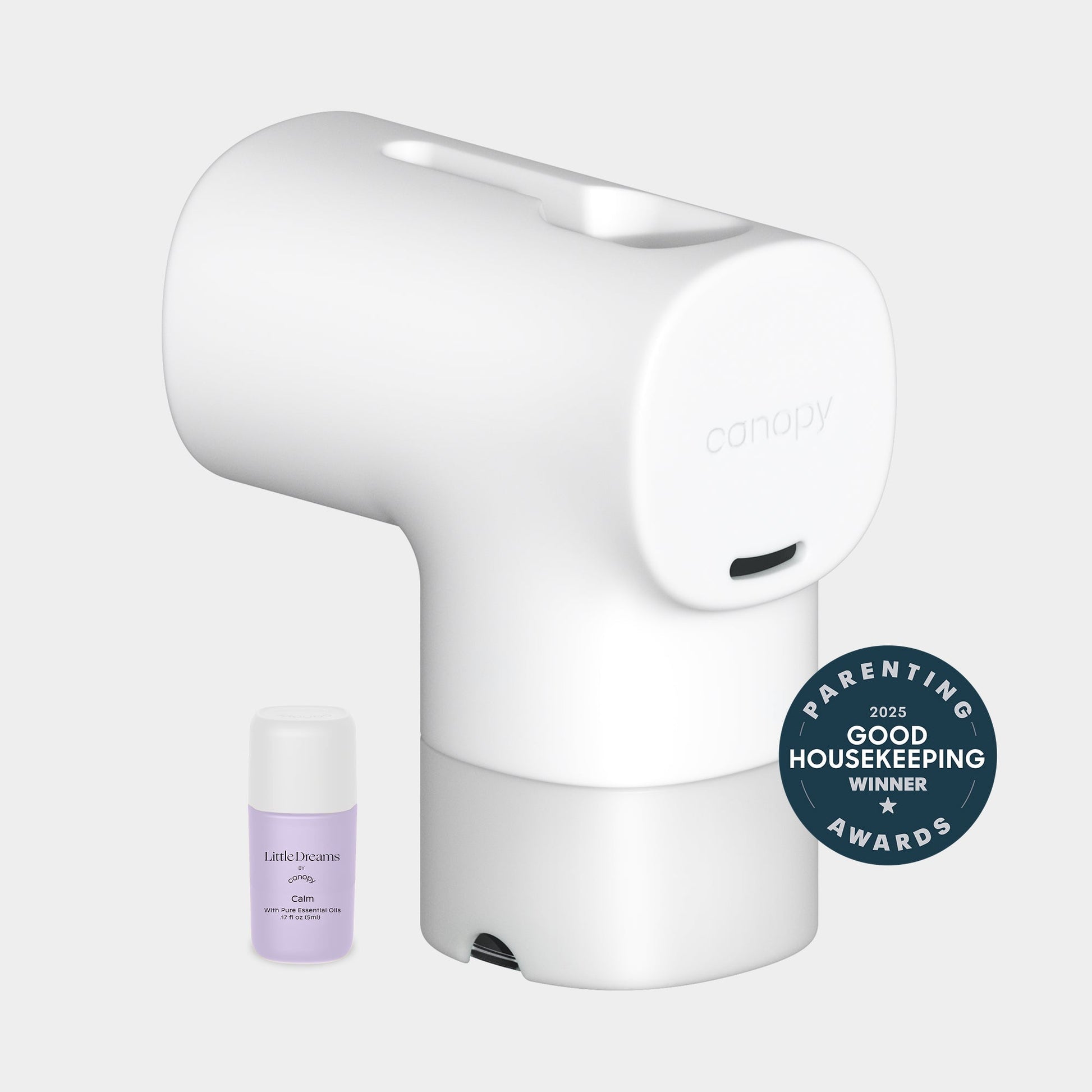 A white Canopy Baby Bath Tub Filter with a small essential oil bottle beside it, and a circular badge that reads "2025 Good Housekeeping Winner Parenting Awards." Fulfilled by Canopy.