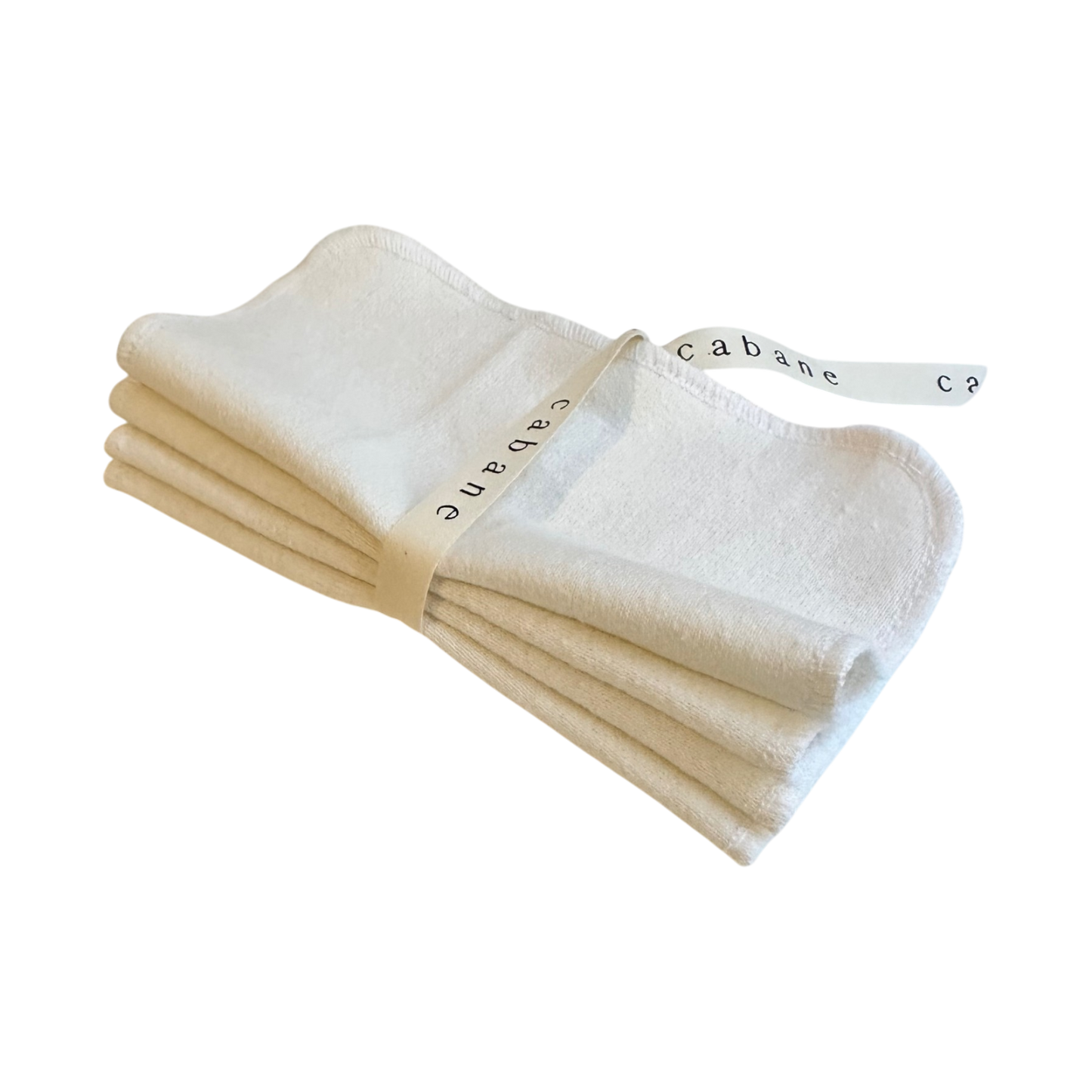 A set of four neatly folded ORGANIC WASHCLOTHS from cabane childrenswear, secured with a white ribbon printed with "cabane" in black letters, shown against a transparent background.