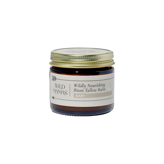 A small brown glass jar with a gold lid, labeled "Wildly Nourishing Bison Tallow Balm - Baby" by Wild Mamas, features a simple black-on-light label and highlights the skincare benefits of bison tallow for babies.