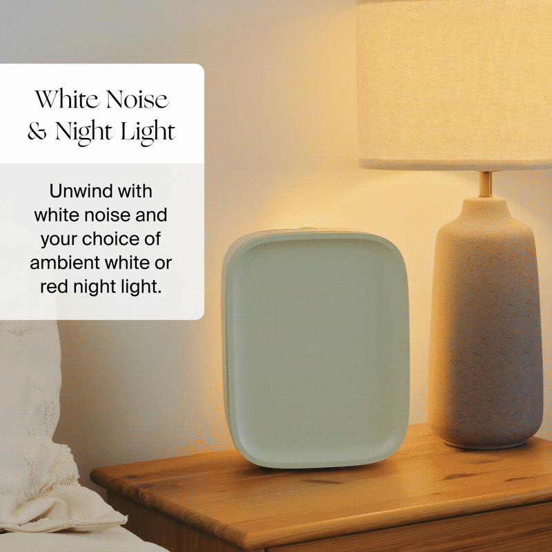 A minimalist nightstand with the Canopy Nursery Air Purifier next to a beige lamp. Text reads: "Nursery Air Purifier. Unwind with clean air and soothing white or red night light, fulfilled by Canopy.