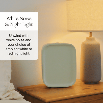 A minimalist nightstand with the Canopy Nursery Air Purifier next to a beige lamp. Text reads: "Nursery Air Purifier. Unwind with clean air and soothing white or red night light, fulfilled by Canopy.
