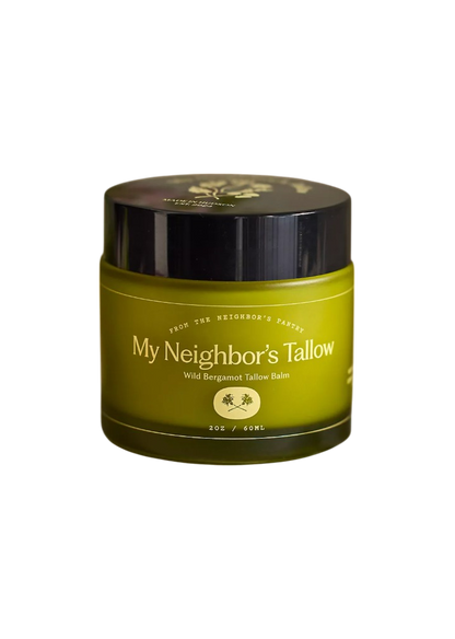 A green 2 oz jar of My Neighbor’s Tallow Wild Bergamot - Tallow Balm with a black lid and white text; this rejuvenating balm is rich in essential fatty acids.