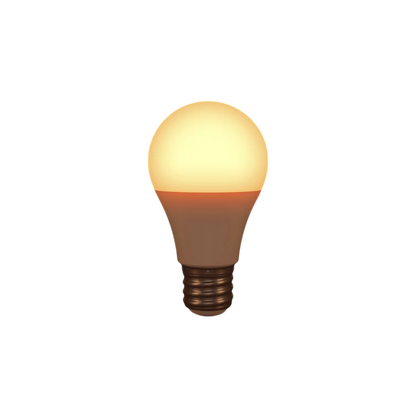 The Healthy Home Shop's Circadian Lightbulb, with a standard screw base and classic rounded shape, emits a circadian-friendly warm yellow light. The glowing filament stands out beautifully against a plain black background.