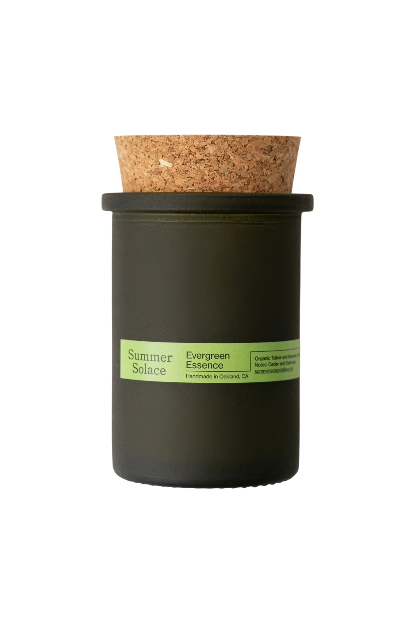The Summer Solace Tallow Evergreen Essence (Cedar and Oakmoss) Candle is a handmade, dark green glass jar candle with a cork lid. Crafted in Oakland, CA, it features a woodsy forest scent and uses Regenerative Tallow® with organic ingredients.