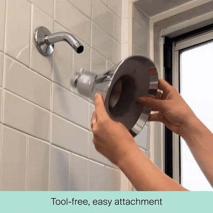 A person easily attaches Canopy’s Filtered Showerhead—a large, round model—to a wall-mounted shower arm without any tools. Text at the bottom reads, “Tool-free, easy attachment.” Fulfilled by Canopy.