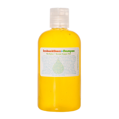 A clear plastic bottle filled with bright yellow liquid, labeled "Seabuckthorn Shampoo" from Living Libations, promises to "Revitalize + Renew Happy Hair." Infused with botanical delights and coco-protein, it features a list of various natural ingredients and is topped with a white flip-top cap.