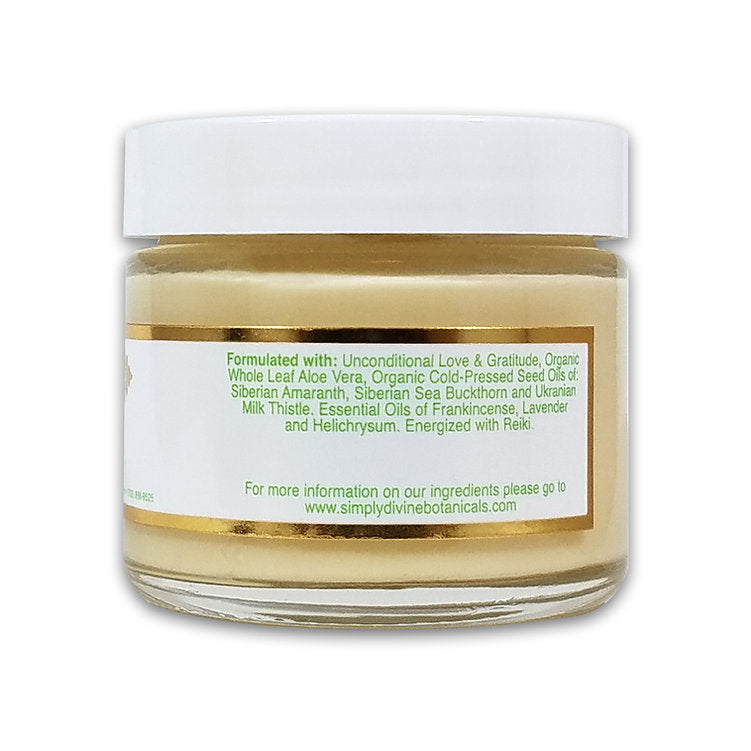 Simply Divine Botanicals' From Russia With Love Protective Regenerating Moisturizer is a vegan, Reiki-energized cream in a small glass jar with aloe vera, sea buckthorn, milk thistle, frankincense, and lavender for deep hydration.