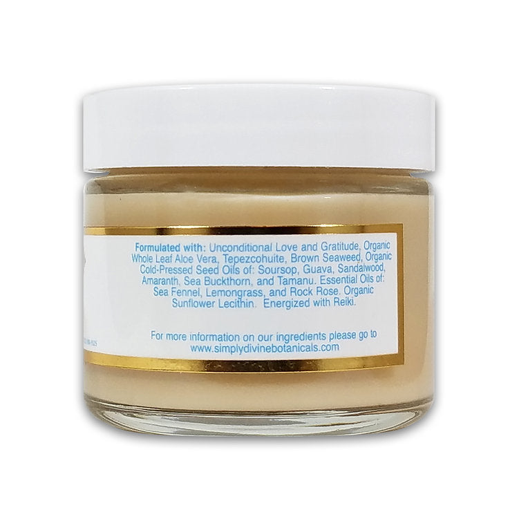 The Simply Divine Botanicals On A Clear Day Blemish Banishing Moisturizer comes in a glass jar with a white lid and blue-and-white label. Infused with aloe vera, seaweed, soursop, amaranth, sea buckthorn & essential oils; Reiki energized for combination and oily skin.